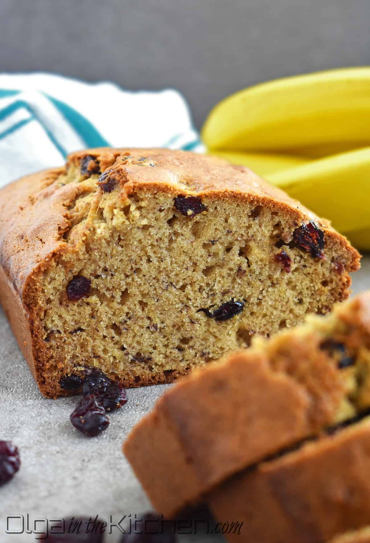 Cranberry Banana Bread is perfectly moist, slightly sweet and loaded with sweet tangy cranberries. This wonderfully moist and soft banana bread is even better with overripe bananas! #olgainthekitchen #bananabread #cranberrybread #cranberrybananabread #bananacranberrybread #bread #easyrecipe #dessert