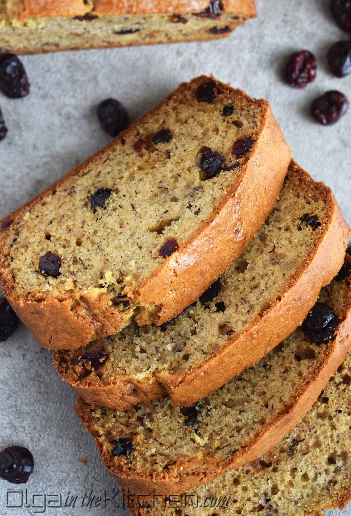 Cranberry Banana Bread is perfectly moist, slightly sweet and loaded with sweet tangy cranberries. This wonderfully moist and soft banana bread is even better with overripe bananas! #olgainthekitchen #bananabread #cranberrybread #cranberrybananabread #bananacranberrybread #bread #easyrecipe #dessert