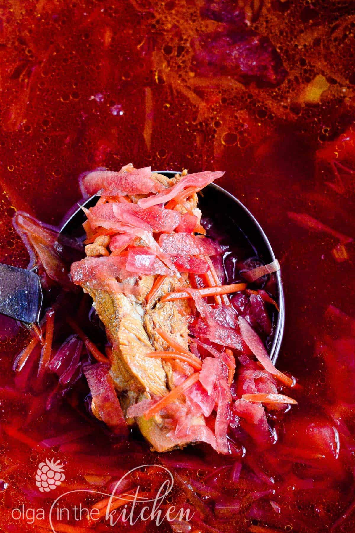 This Classic Red Borscht with Ribs (beet soup) is a traditional Ukrainian dish, loaded with vegetables such as potatoes, beet, cabbage, carrots and more. This hearty soup is very popular and loved by so many all around the world. | olgainthekitchen.com