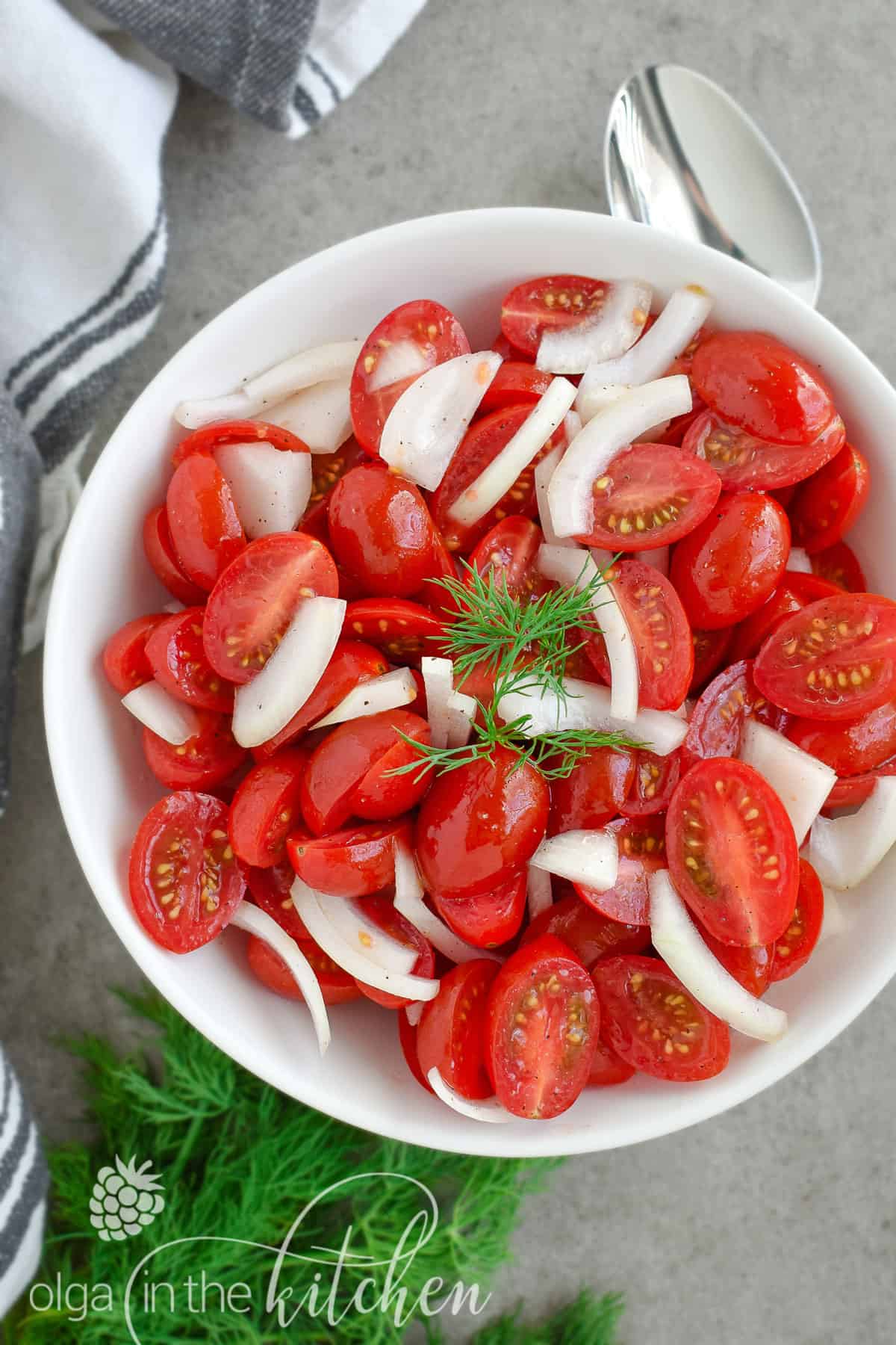 This super Quick Tomato Salad is a summer favorite at every BBQ party. Simple, fresh and delicious and only takes 10 minutes to put together! | olgainthekitchen.com
