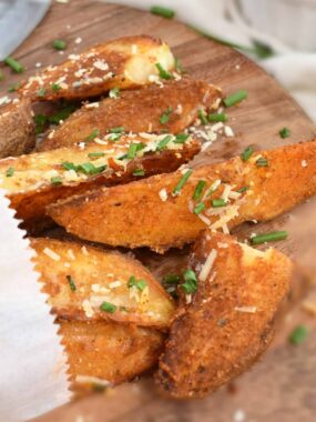 Oven Baked Potato Wedges: a delicious alternative to french fries, seasoned with parmesan cheese and fresh chives. | olgainthekitchen.com