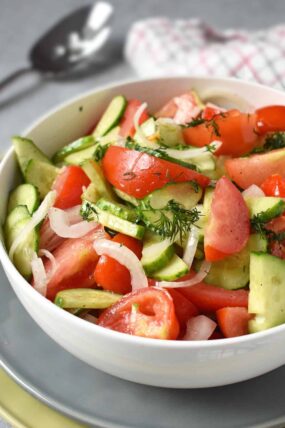 Tomato and Cucumber Salad: the easiest and the simplest 3-veggie plus a dressing salad that will wow the crowd. | olgainthekitchen.com