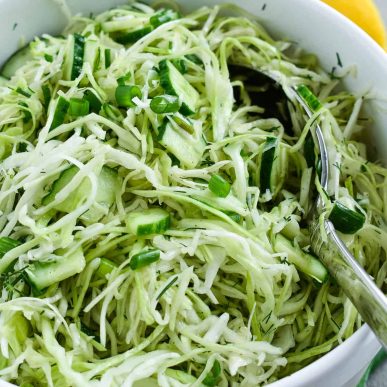 Easy Green Cabbage Cucumber Salad is loaded with fresh green cabbage, crisp cucumbers and fresh herbs. It’s the perfect side dish for potlucks, parties and barbecue. #cabbagesalad #olgainthekitchen #salad #healthy #easyrecipe #cucumbersalad #cabbagecucumber #holiday #easter