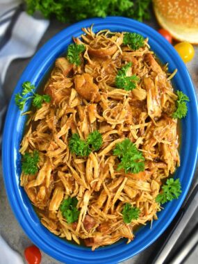 Slow Cooker BBQ Chicken: fall-apart tender, juicy, sweet and delicious. Serve in buns as a sandwich, on a side of rice, mashed potatoes or on a slice of bread. | olgainthekitchen.com