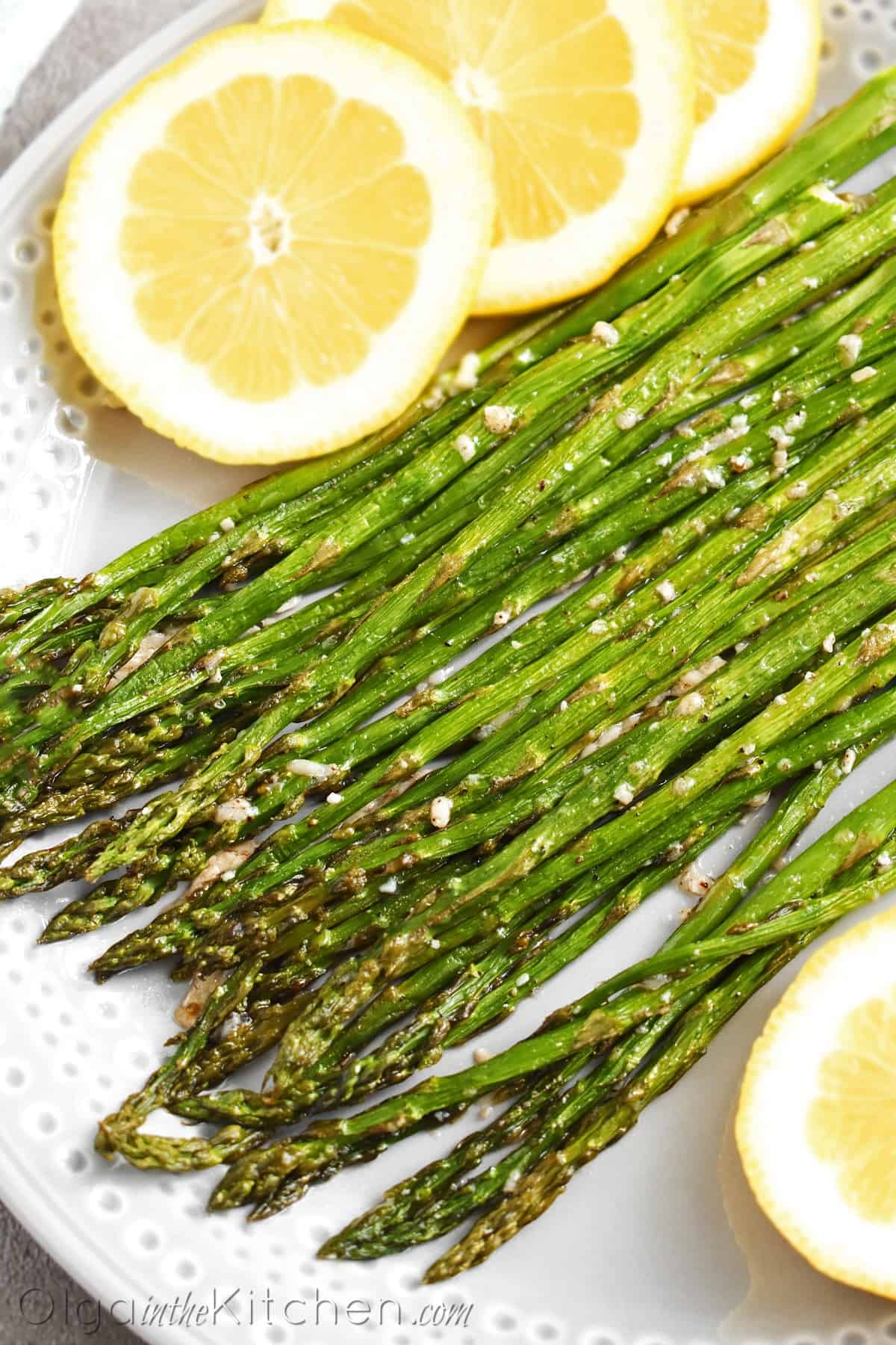 Roasted Asparagus with Parmesan: an easy and super tasty side dish to any main dish in 20 minutes. We like these with grilled pork, beef, chicken or any salmon dish. | olgainthekitchen.com