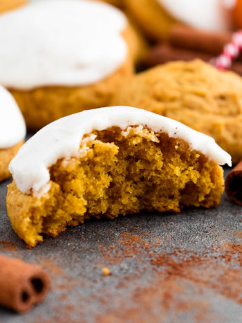 Super soft and fluffy Iced Pumpkin Cookies, topped with a sweet vanilla cinnamon icing and are a must for the fall season. | olgainthekitchen.com