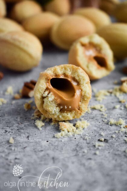 Oreshki are the traditional crisp and flaky walnut shaped cookies filled with dulce de leche filling. These beautiful delights are the iconic treats for Slavic families, especially during holidays and special occasions. | olgainthekitchen.com
