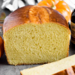 Ukrainian Pumpkin Bread is delicious any time of the year! It has a mild pumpkin flavor from homemade pumpkin puree, a yellow-ish fluffy and tender texture and a shiny dark-brown crust. | olgainthekitchen.com