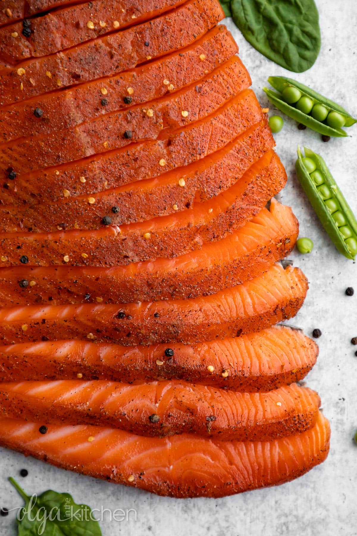 Easy Smoked Salmon is juicy and flaky with a simple salt, sugar and pepper cure. An easy step-by-step guide to make the best and most delicious hot Smoked Salmon at home. #smokedsalmon #salmon #olgainthekitchen #holiday #summer #homemade