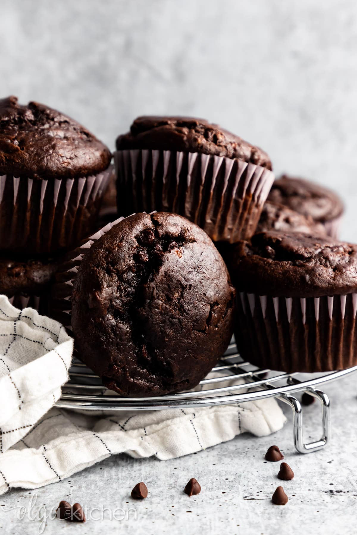 These Double Chocolate Banana Muffins are so easy to make, bursting with rich chocolate flavor and loaded with chocolate chips. They are soft and perfectly moist. #olgainthekitchen #bananamuffins #chocolatemuffins #muffins #chocolatebananamuffins #breakfast