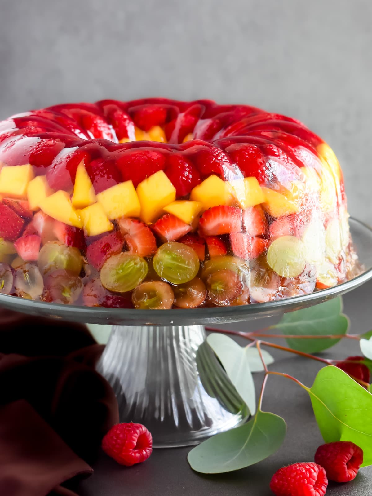 This jello fruit cake combines fresh fruits with your favorite juice. It is vibrant and refreshing and is loved in summers and during major holidays. You can serve it instead of fruits or as a dessert when you need an easy and crowd-pleasing no-bake dessert. Have fun with different jello flavors and fruits!
